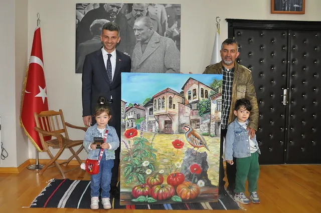Ermenek Belediye Başkanı Mustafa Bozcu, Ressam Öğretmen Mehmet Satırlı’yı makamında